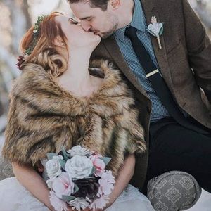 New in packaging! Faux fur wrap. Brooch included.